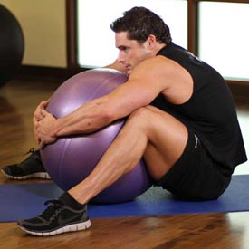 Back Exercise Instructions: How to Perform the Hug a Ball Exercise